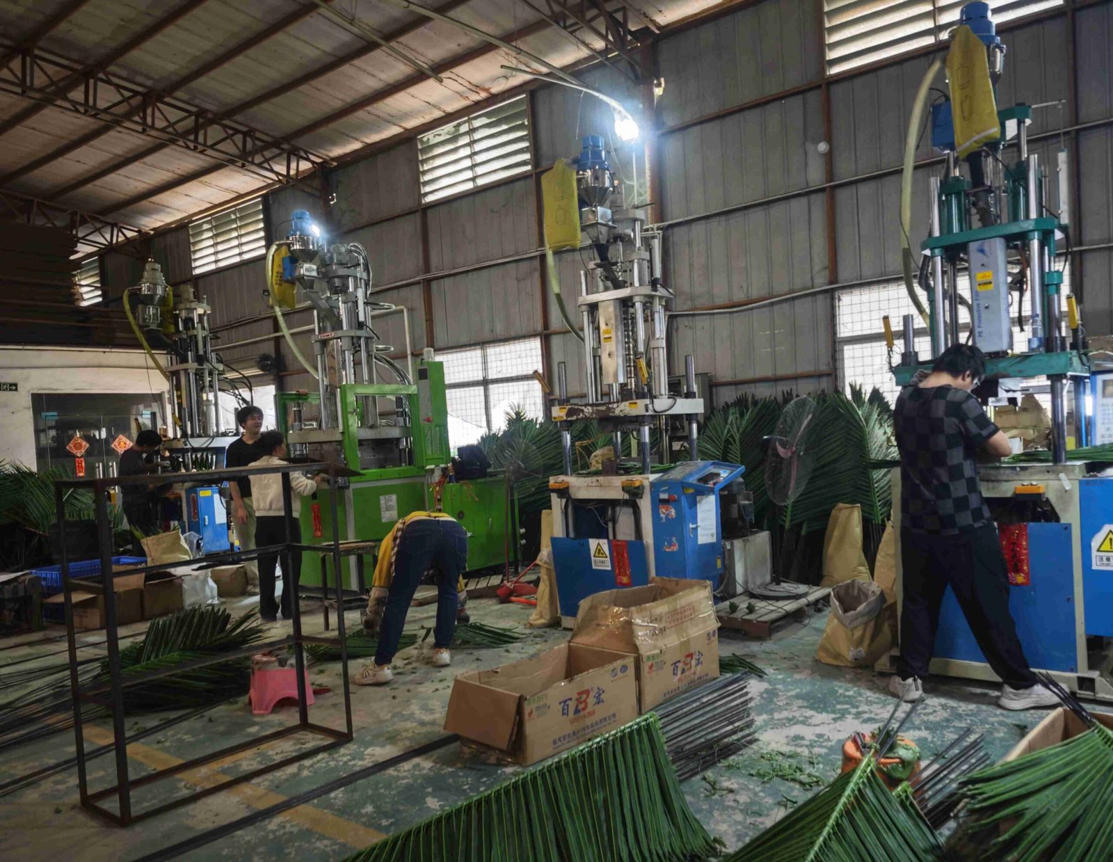 Custom artificial palm tree manufacturing process at Oakco factory