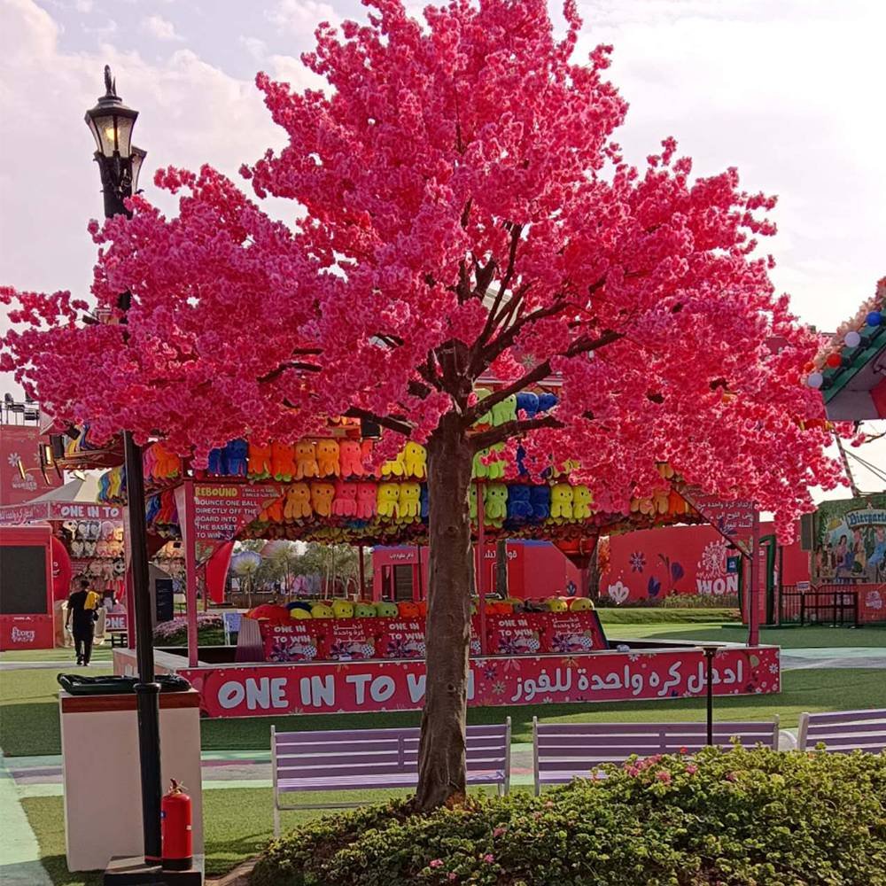 Large pink cherry blossom tree for hospitality spaces Large pink artificial cherry blossom tree used in a hospitality interior