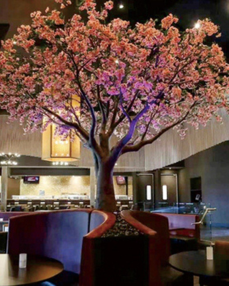 Artificial cherry blossom tree for commercial interiors Artificial cherry blossom tree used in a commercial interior