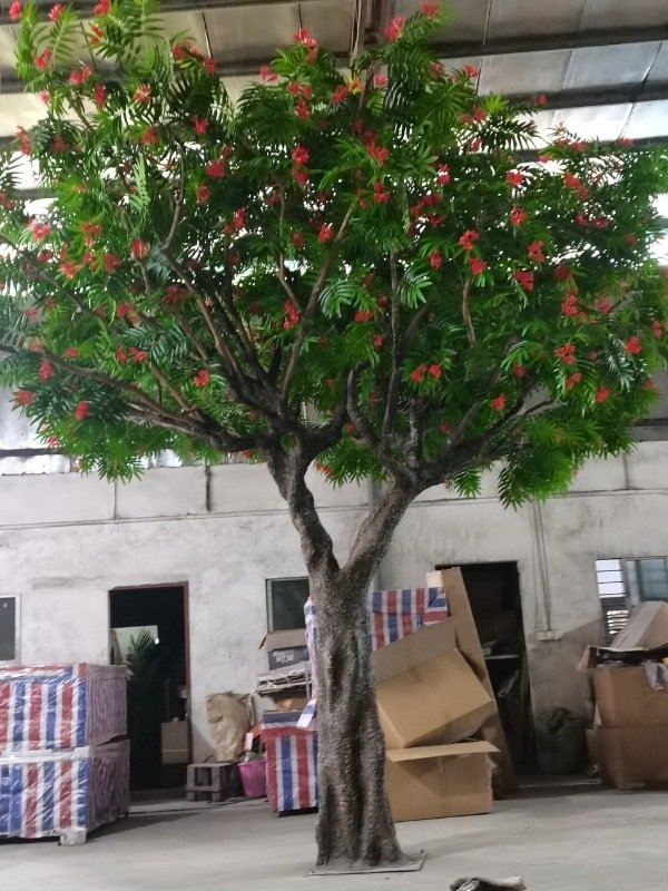 Realistic artificial Flame Tree with vibrant flowers, ideal for hotel lobbies or events.