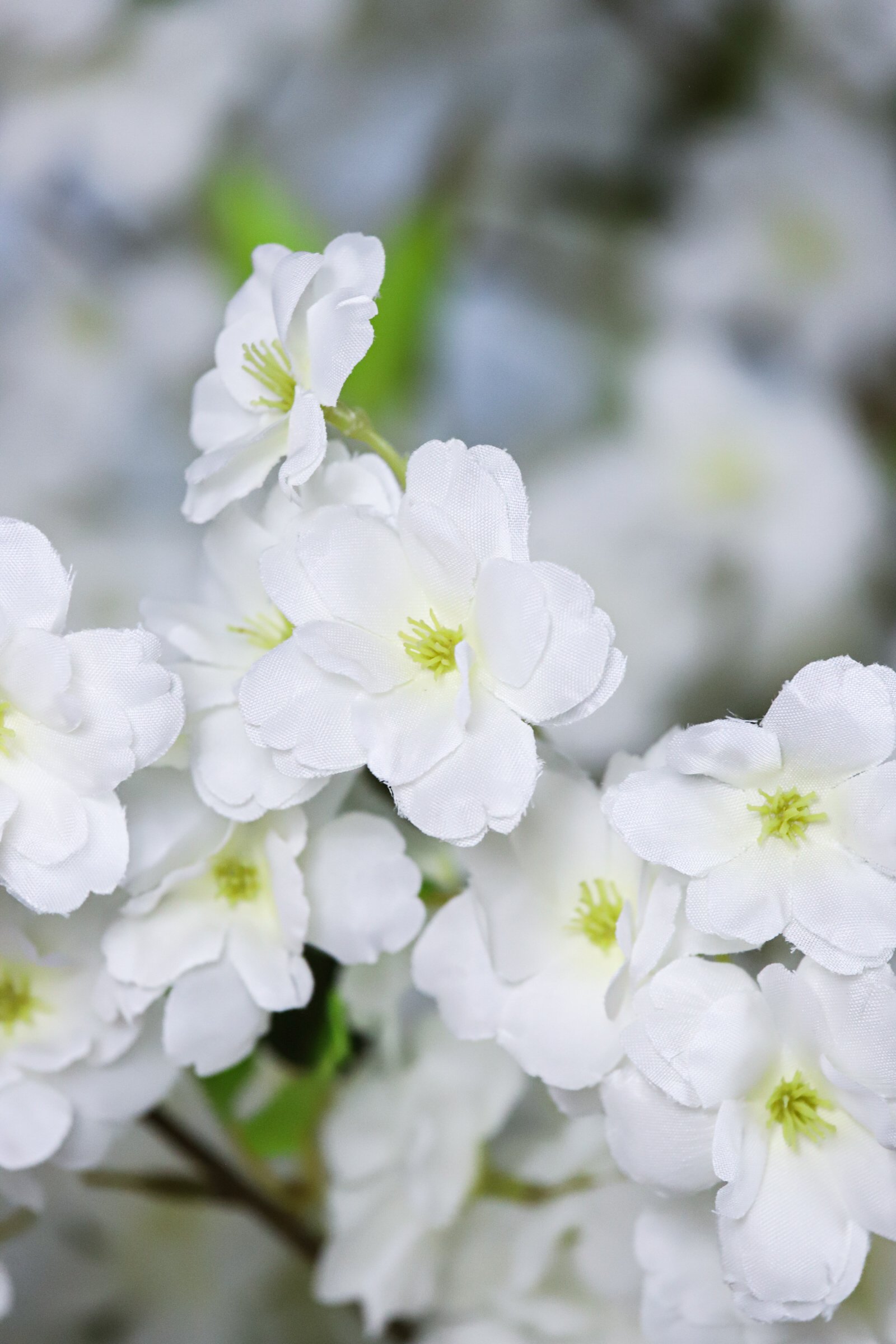 silk white blossoms of artificial cherry blossom tree