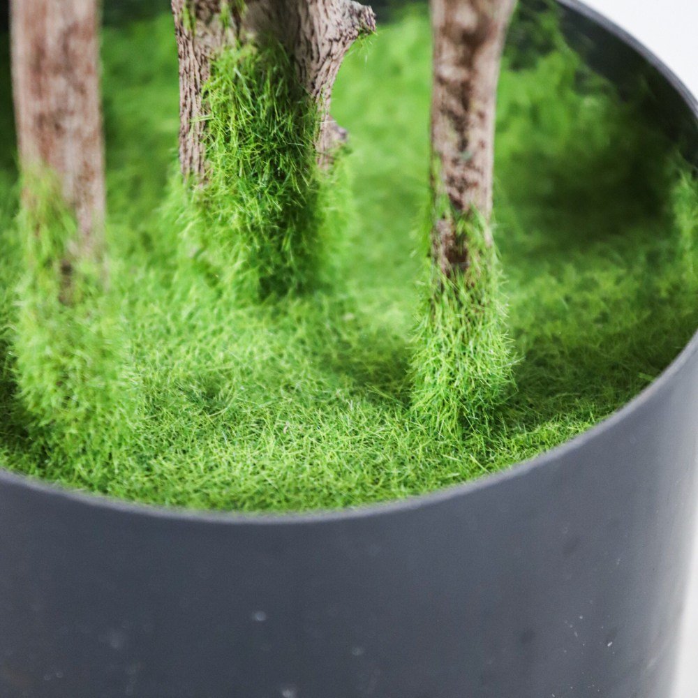 the pot with faux moss of fake Japanese tree