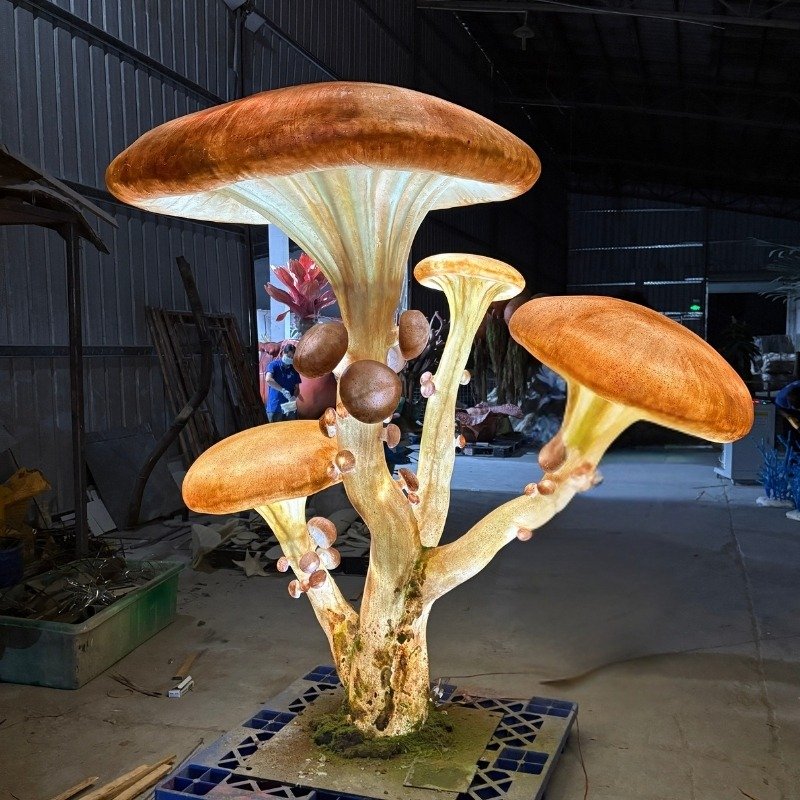Illuminated fantasy mushroom sculpture for a themed environment
