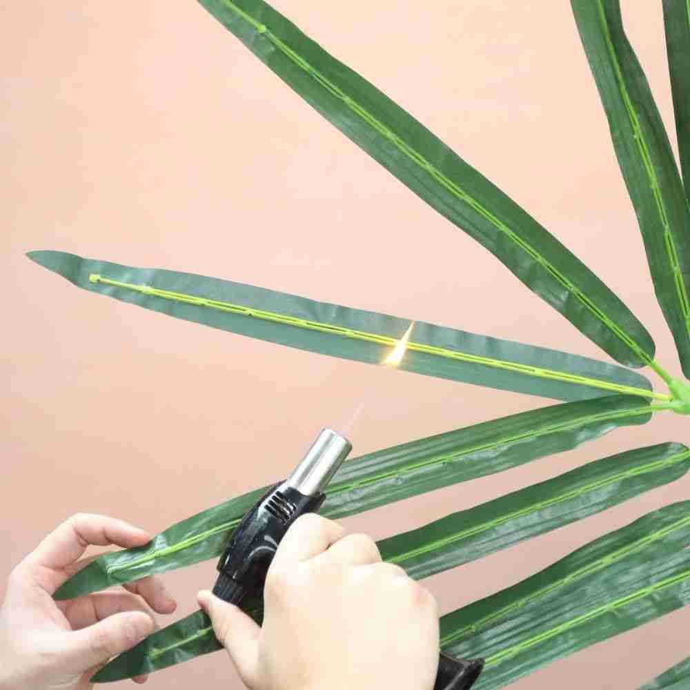 Inherently fire retardant (IFR) artificial foliage undergoing safety test to ensure compliance with NFPA 701 standards.