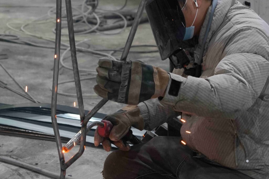 Oakco engineers welding steel structures to ensure durability and safety of large artificial tree installations
