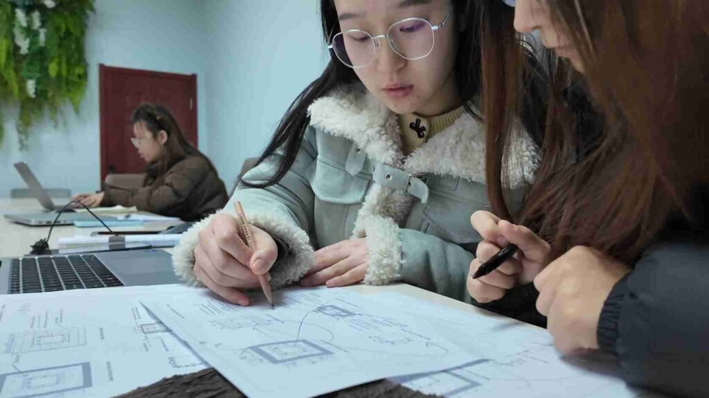 Oakco design team creating artificial tree drawings and project plans for customized commercial landscaping solutions