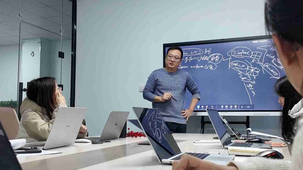 Oakco project manager presenting artificial tree design concepts and coordinating commercial project planning with the team