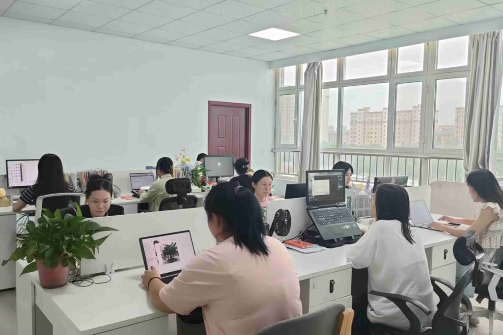 Oakco sales and support team coordinating artificial tree projects and communicating with global clients in office environment