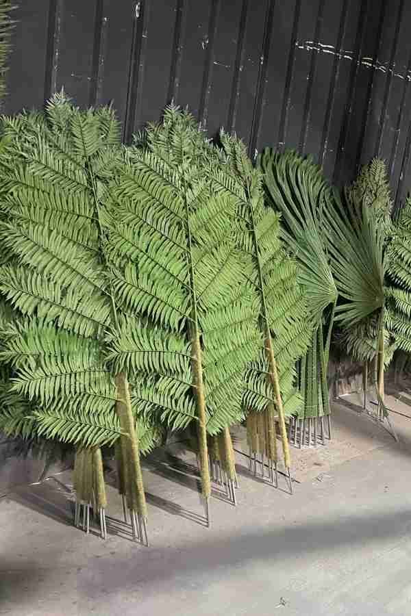 Large stock of UV-resistant and high-density artificial fern fronds at Oakco factory.