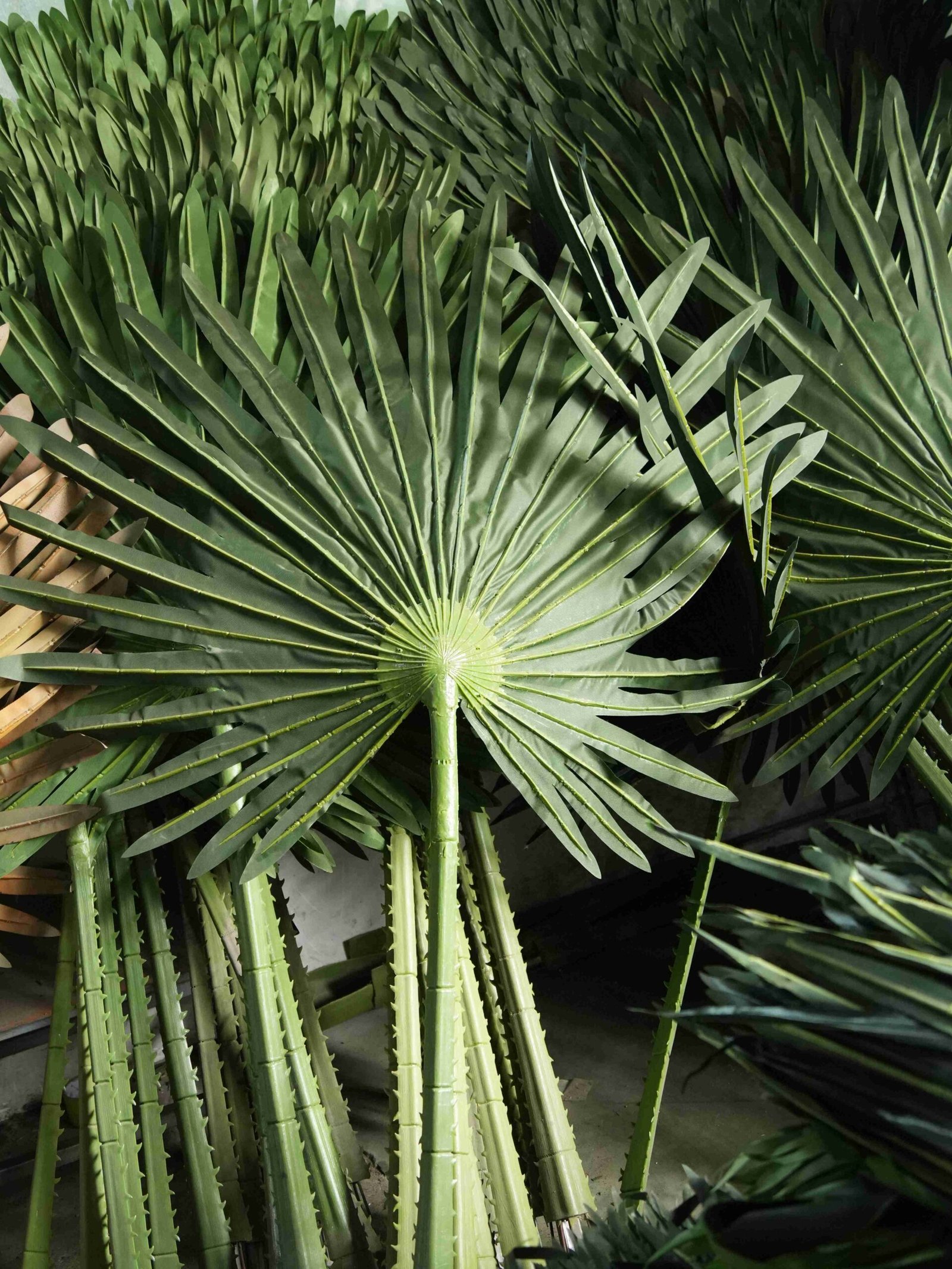 Artificial fan palm leaves for commercial landscaping