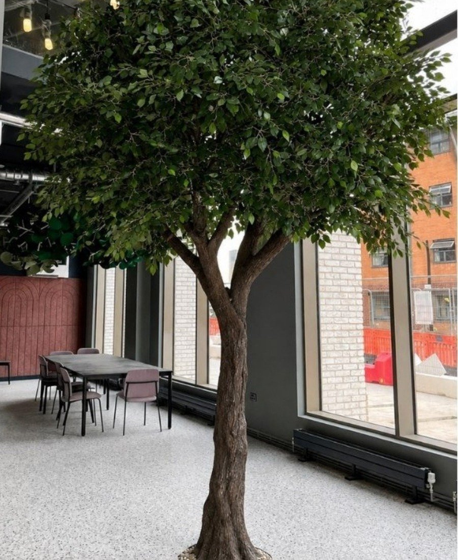 Large artificial banyan tree installed in a commercial lounge