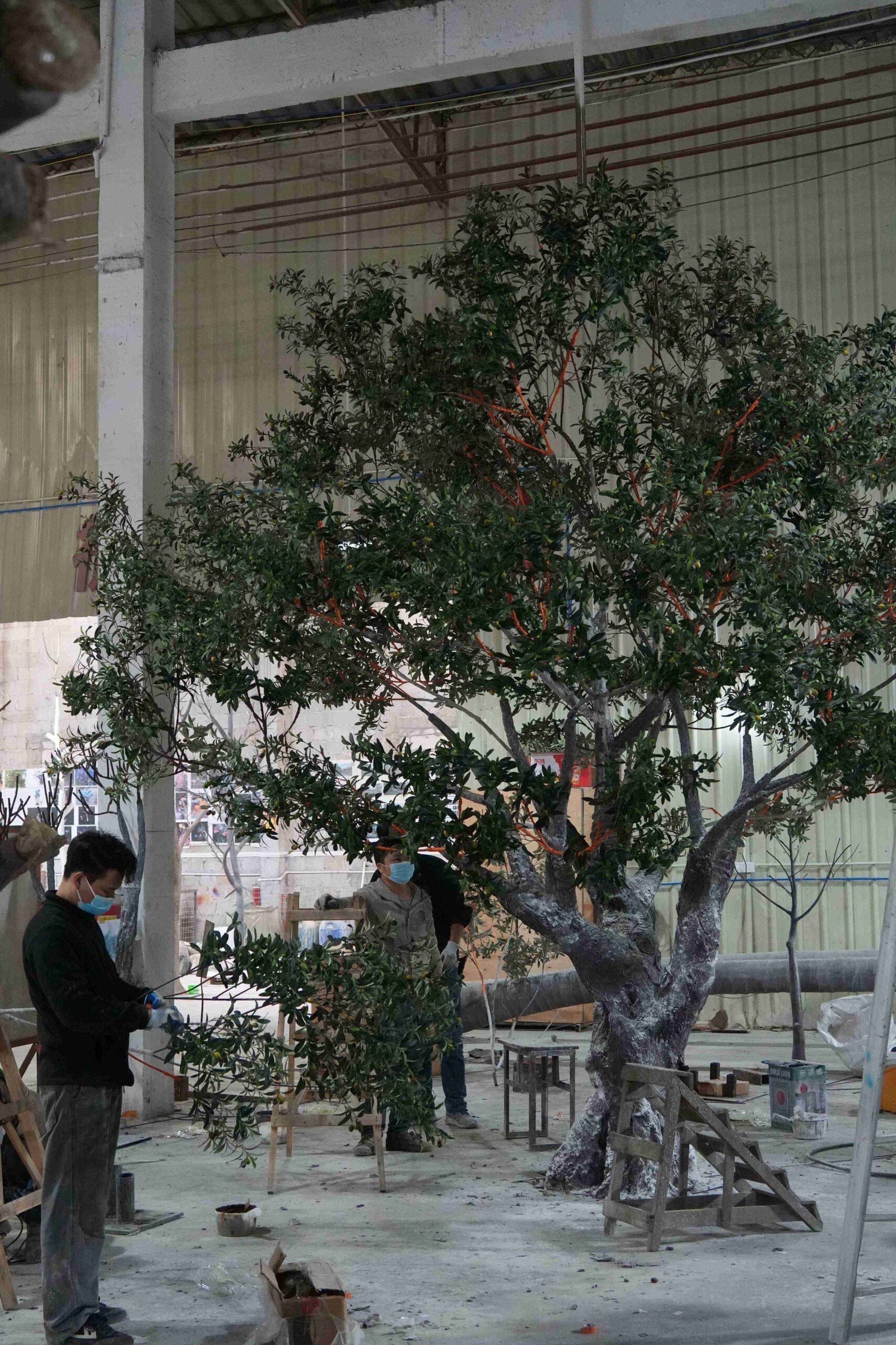 Artificial Olive Tree Canopy Assembly Oakco team shaping artificial olive tree branches and assembling the canopy