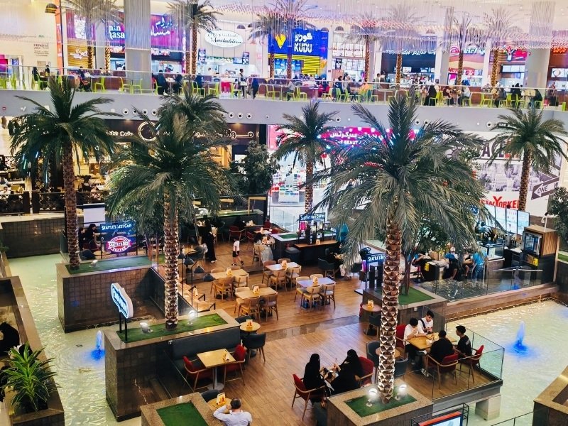 Large artificial palm trees in a Riyadh shopping mall