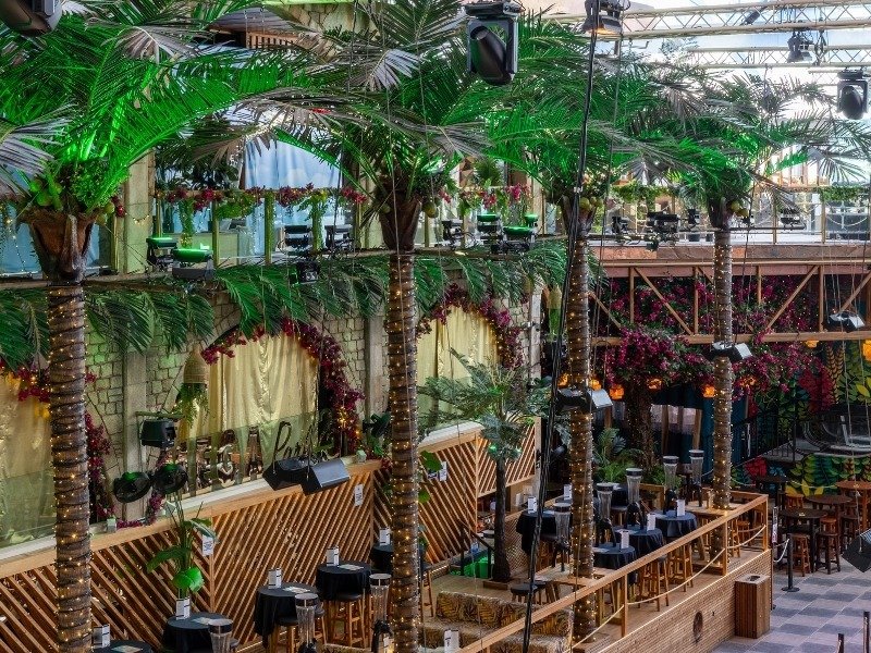 Large artificial palm trees in a commercial venue