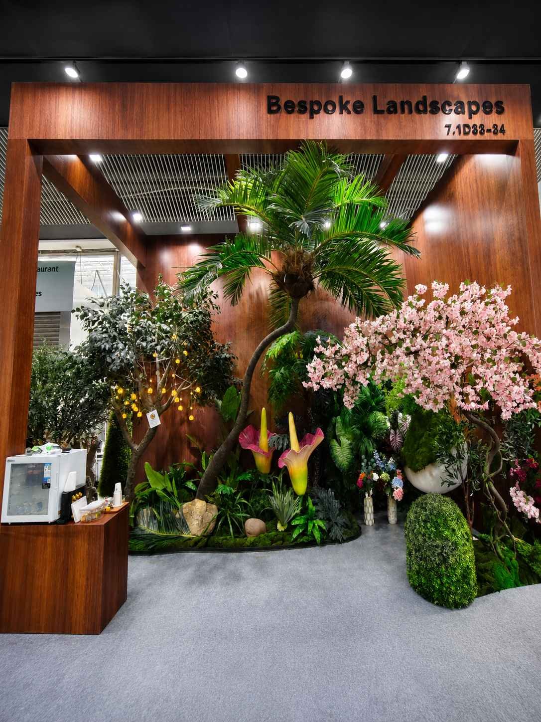 Oakco Bespoke Landscapes booth presenting custom artificial trees and commercial greenery at the 139th Canton Fair