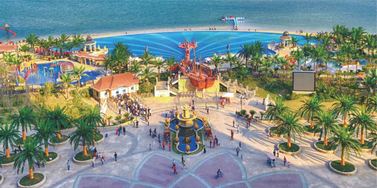 Outdoor artificial palm trees installed in a water park landscape