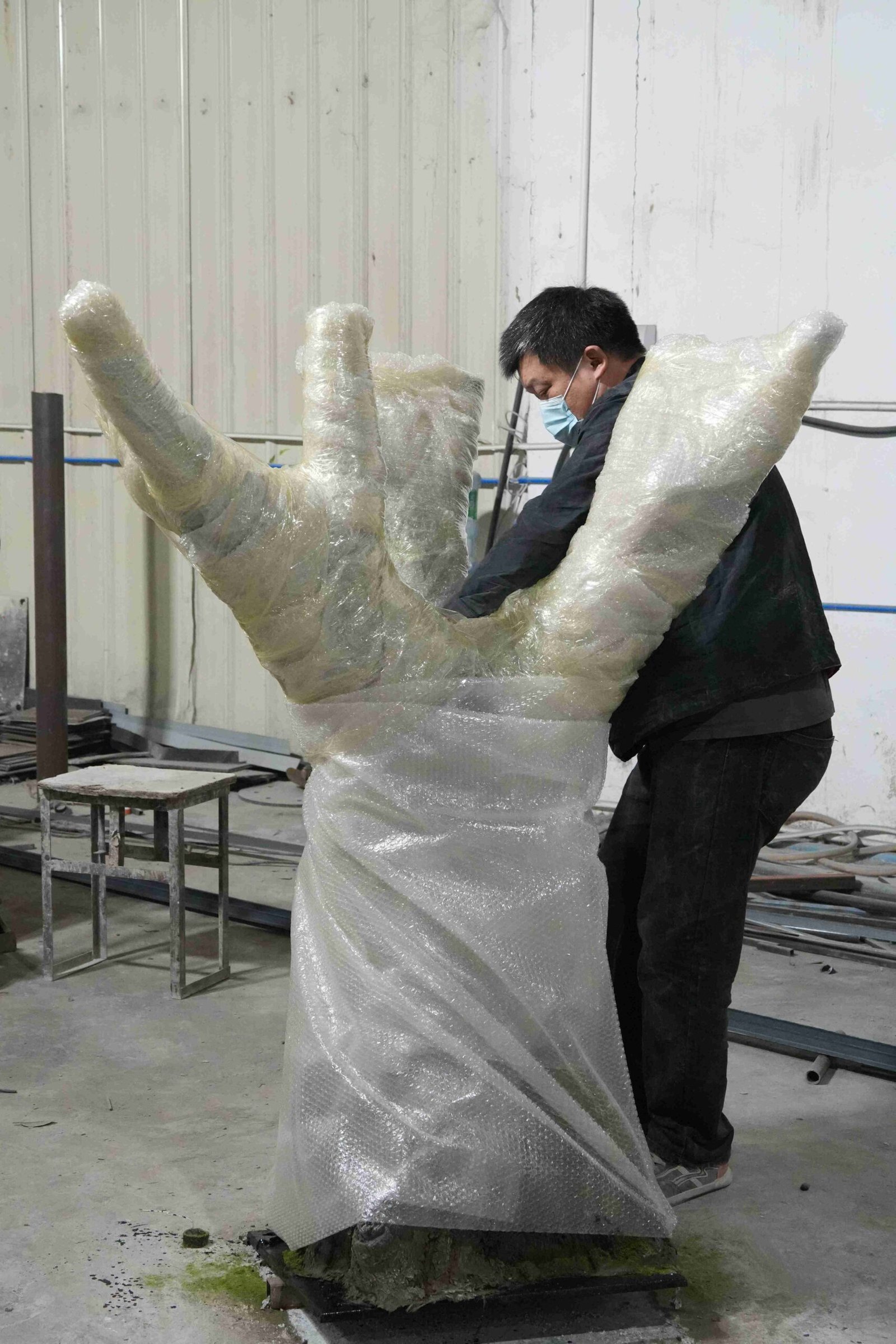 Artificial olive tree trunk wrapped for export protection