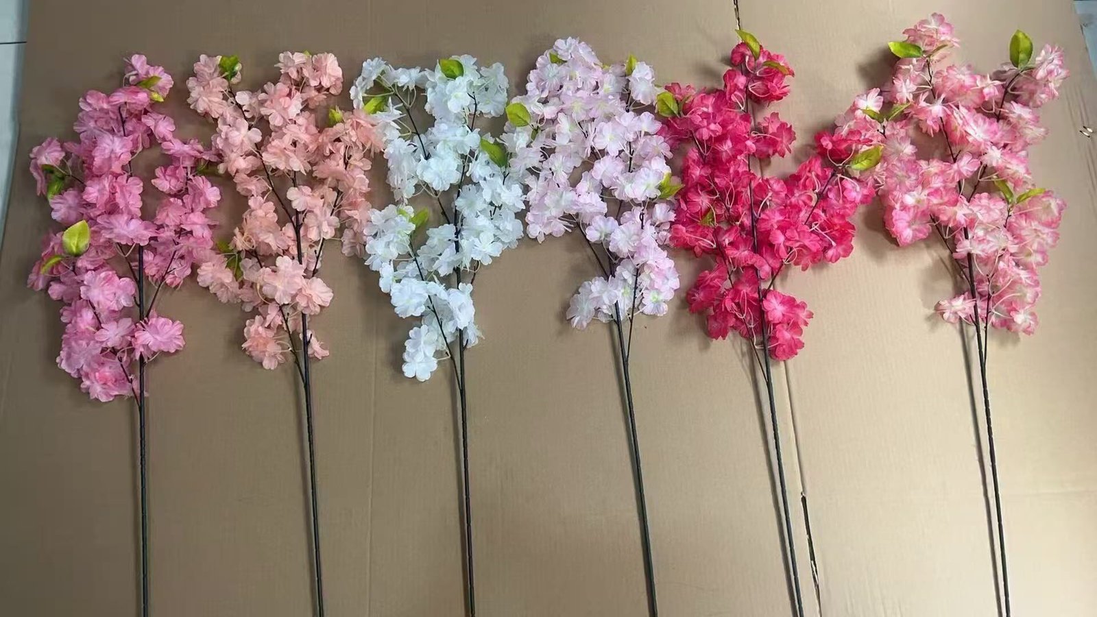 Artificial cherry blossom branch samples in different colour options