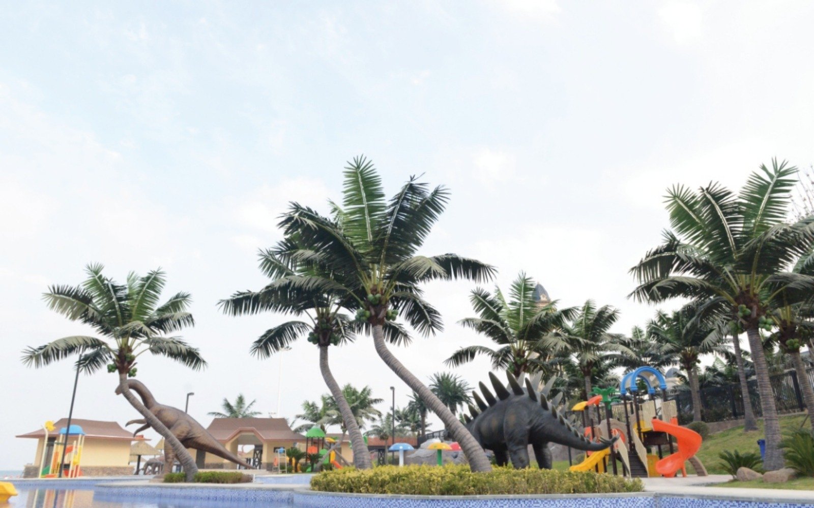 Artificial palm trees shown for projects with different fire and UV performance requirements