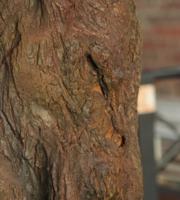 Artificial tree bark finish Hand-finished bark texture on an artificial tree trunk