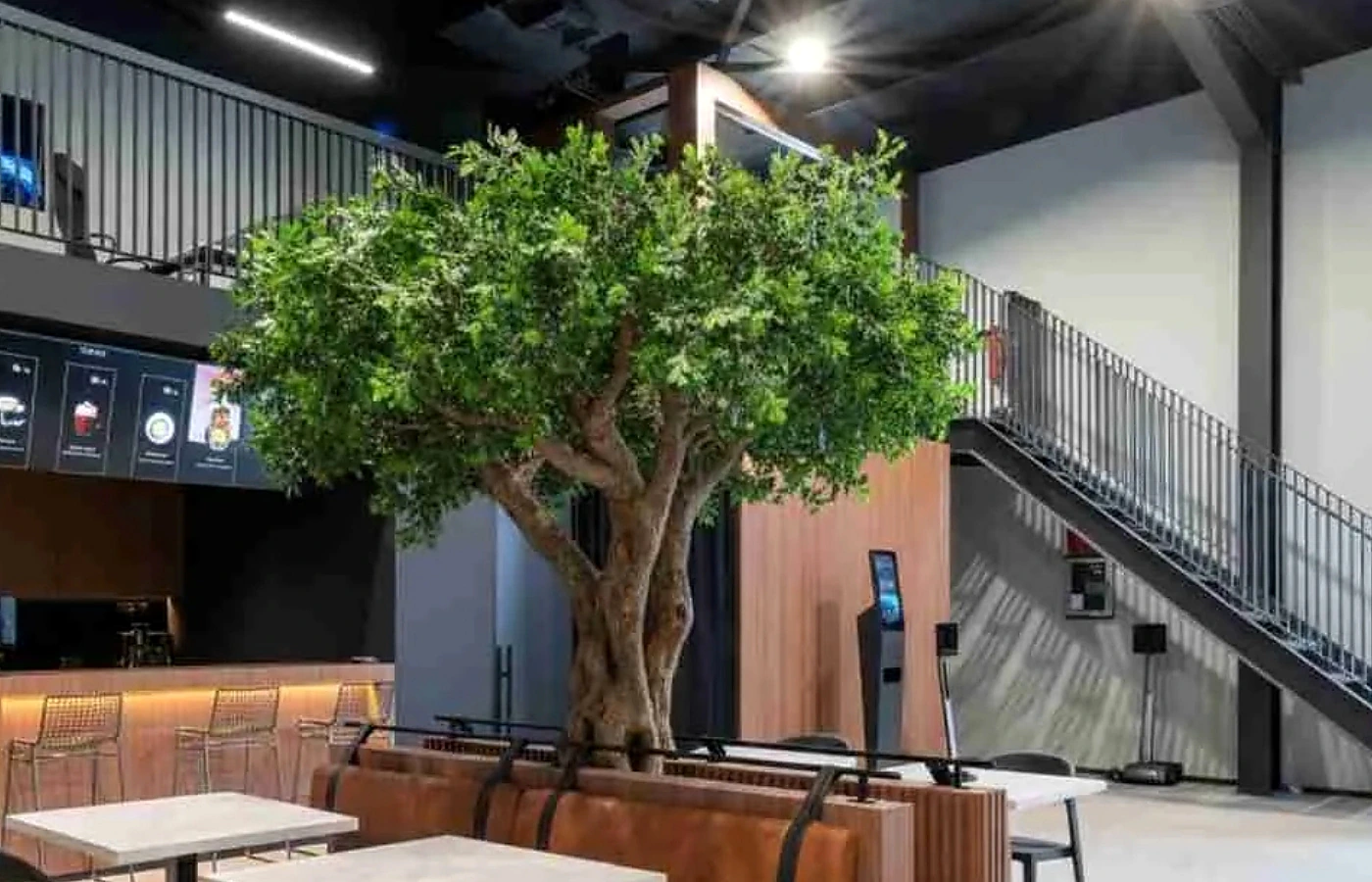 Custom artificial oak tree designed around a commercial seating area