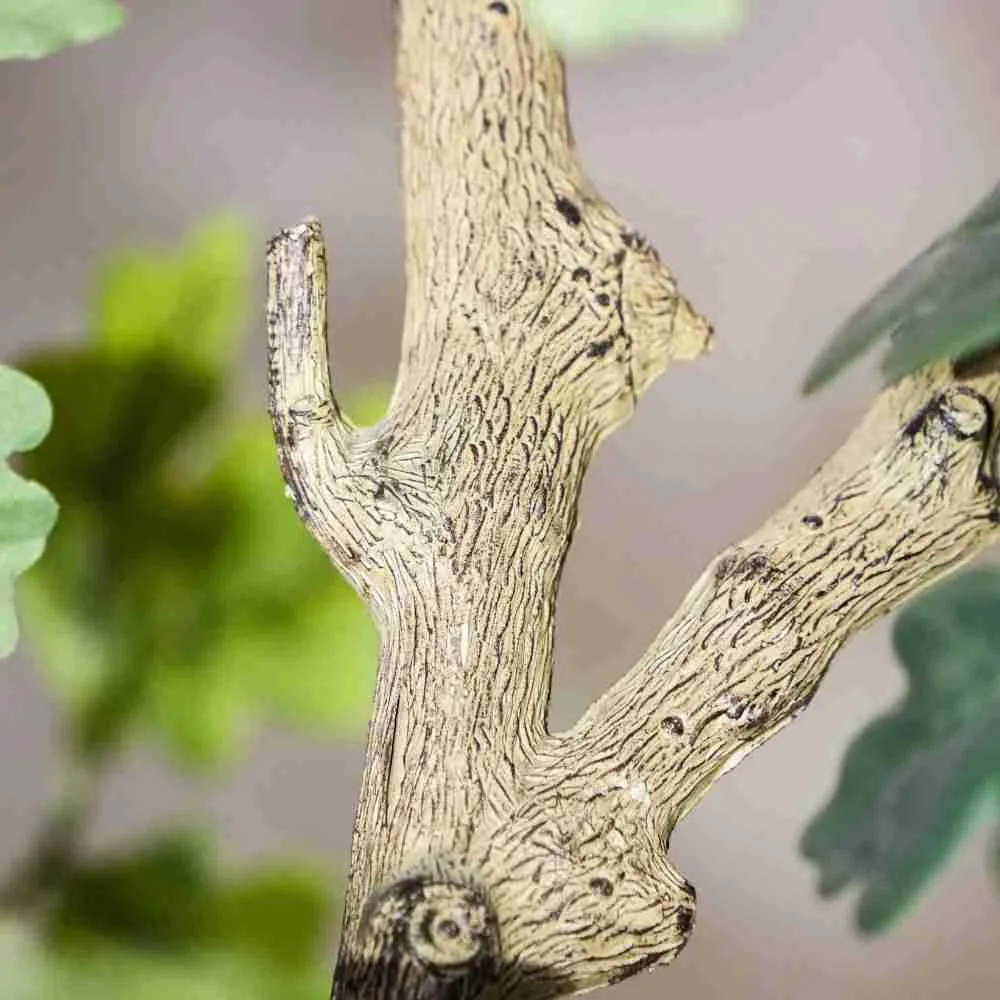 Hand-finished bark texture on an artificial oak trunk