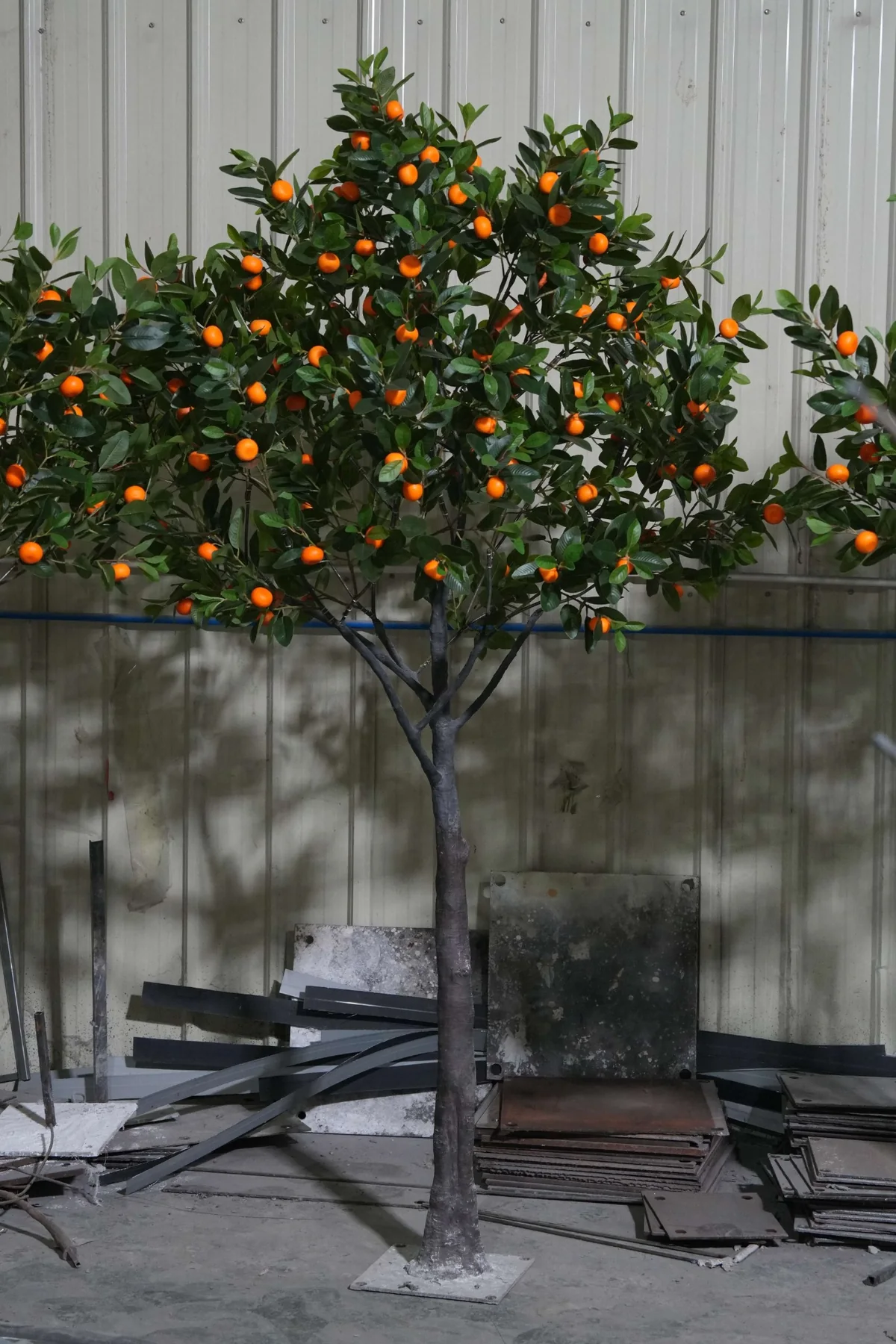 Completed artificial orange tree assembled for factory inspection before packing