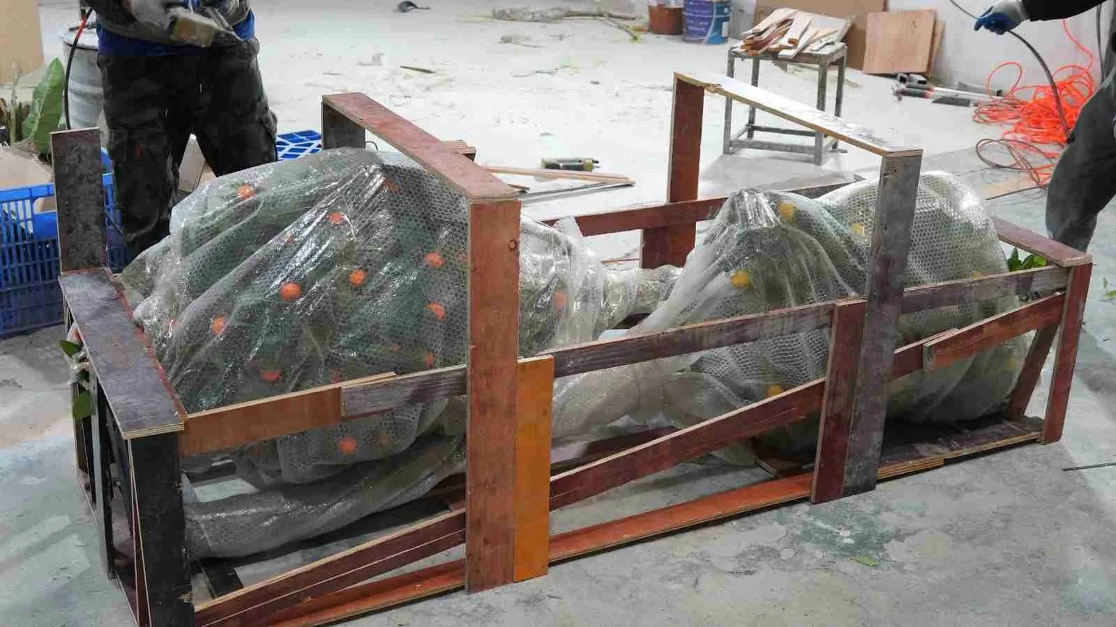 Composite board frame packaging for an artificial tree shipment