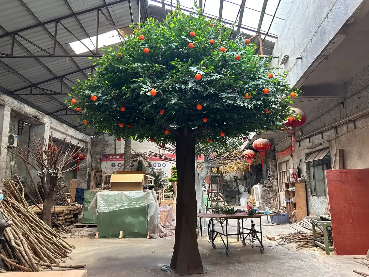 Large custom artificial orange tree completed in the factory before shipping