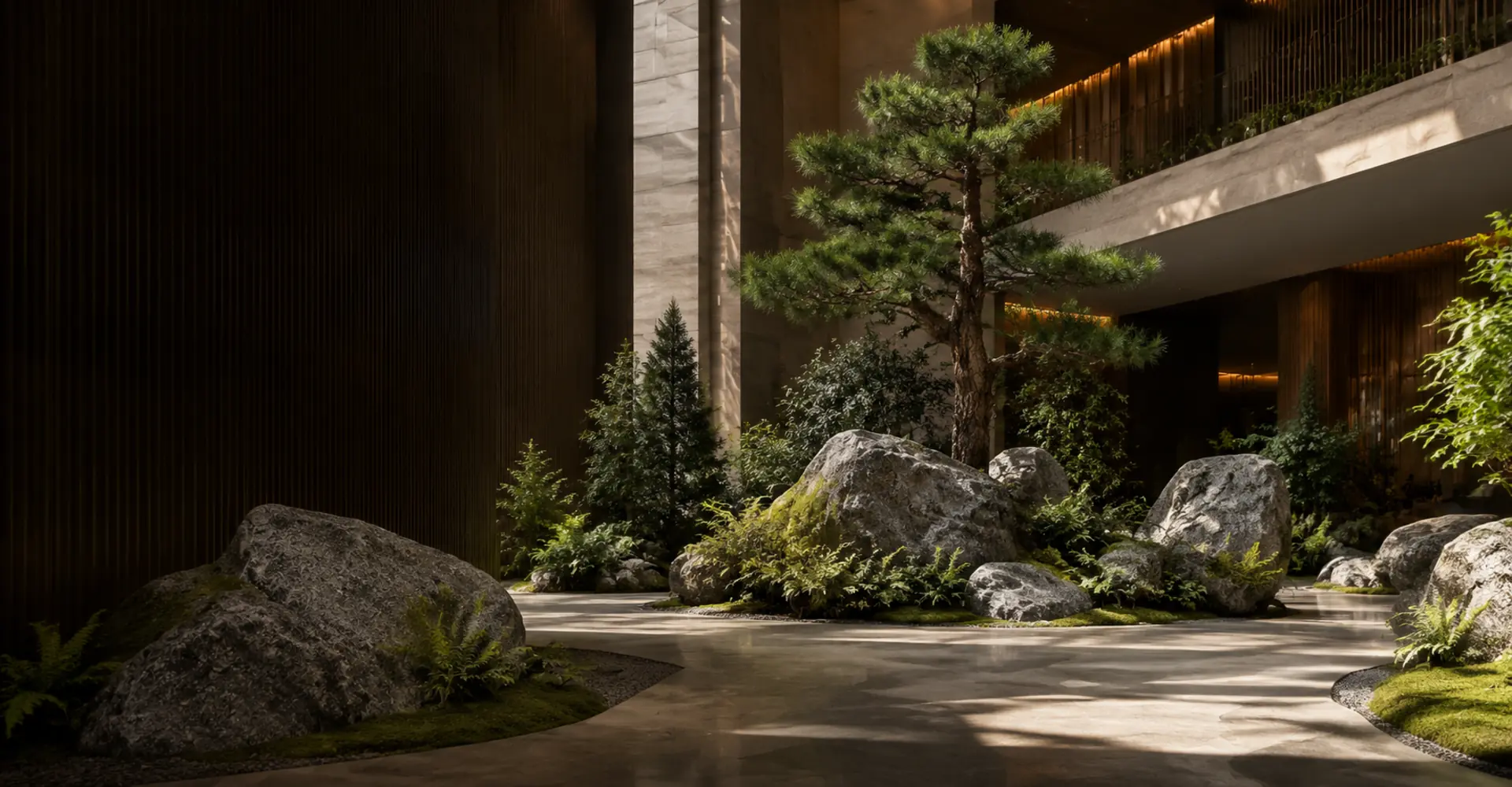 Oakco artificial rockwork integrated with planting and a sculptural tree in a commercial interior