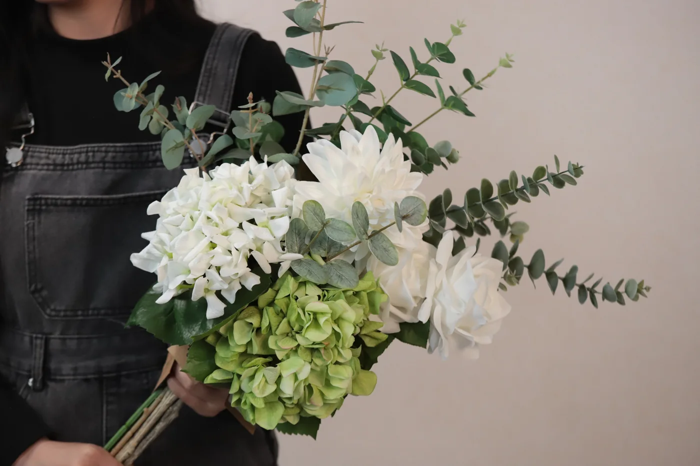 White artificial flowers combined with eucalyptus for a designer composition
