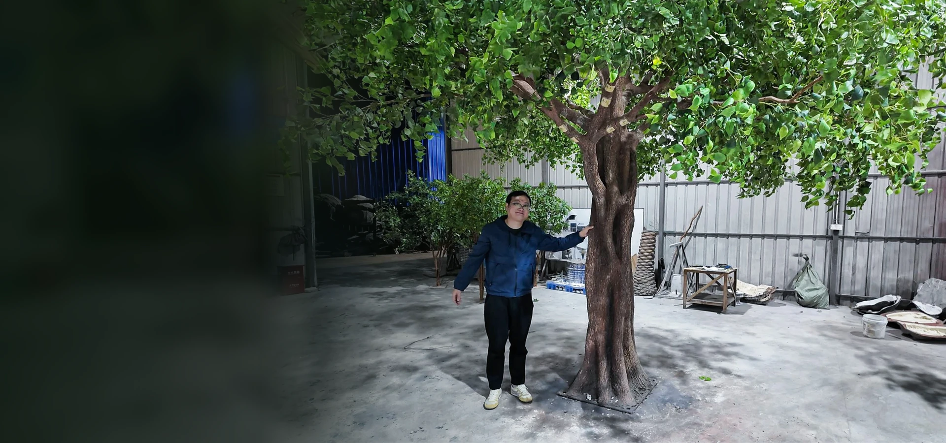 Oakco founder Rick Chao reviewing a large custom artificial tree