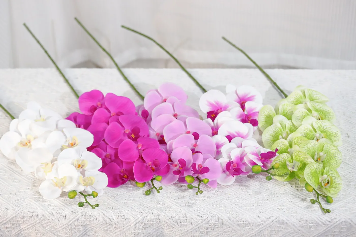 Artificial Phalaenopsis orchid stems in multiple colours for project selection