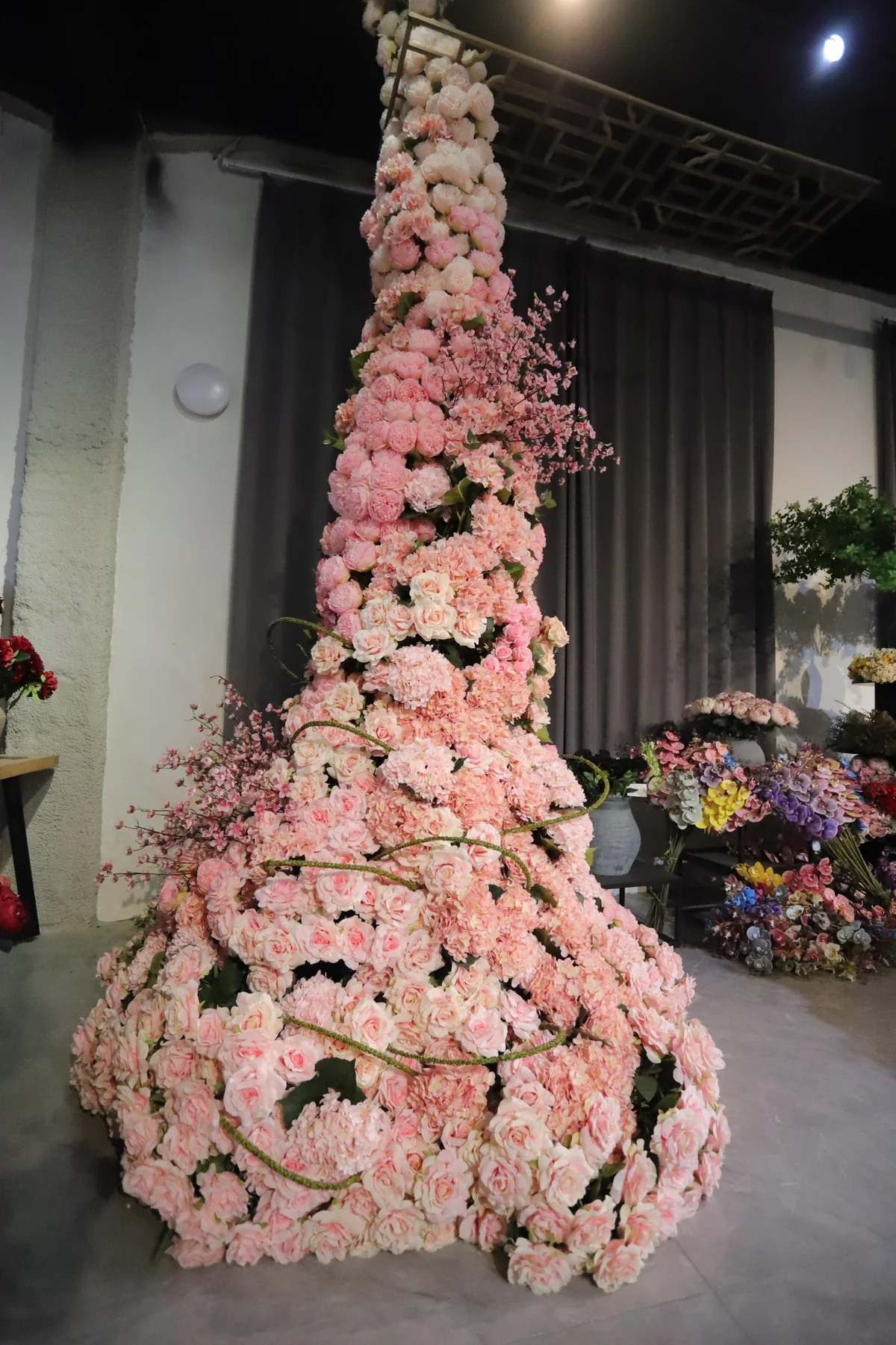 Large pink artificial floral installation for a wedding or event venue