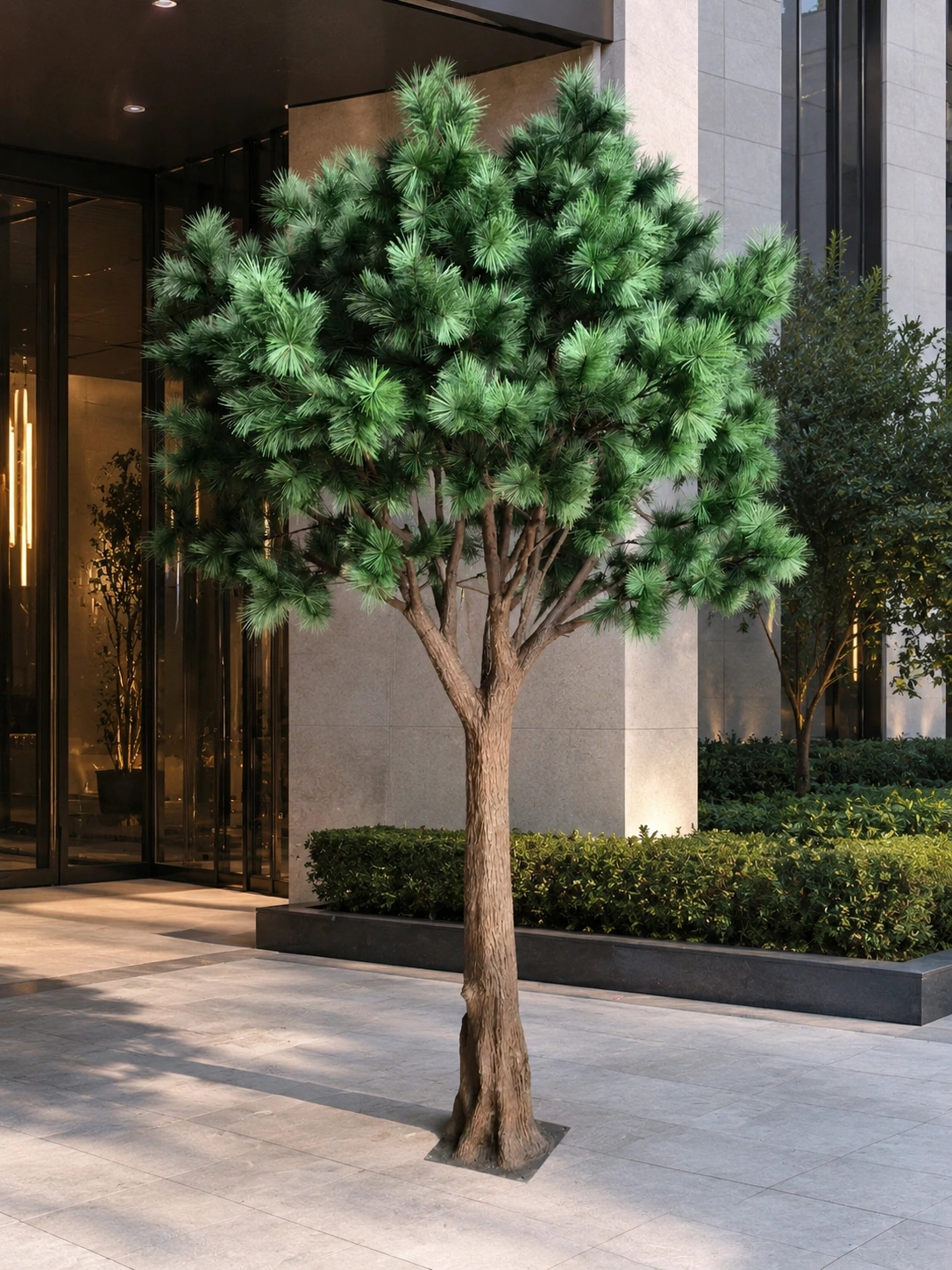 Artificial Pine Tree for Modern Commercial Entrance Landscape Artificial pine tree installed in a modern commercial entrance landscape