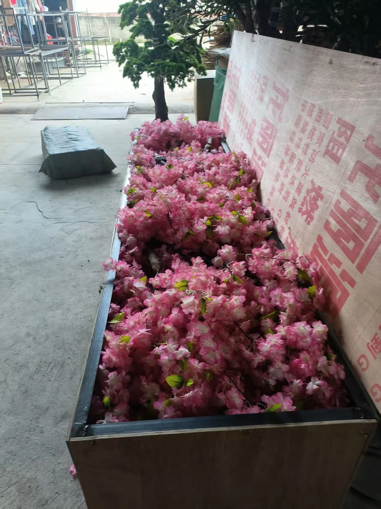 Artificial cherry blossom branches packed in the workshop