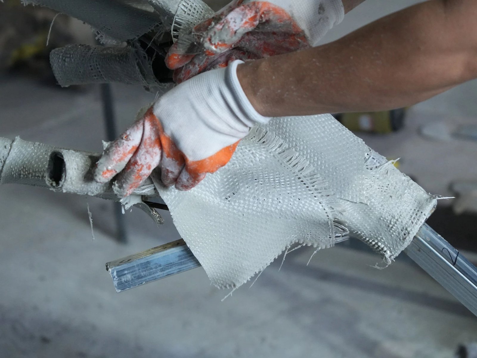 Fiberglass layering process used to form a bespoke artificial tree trunk