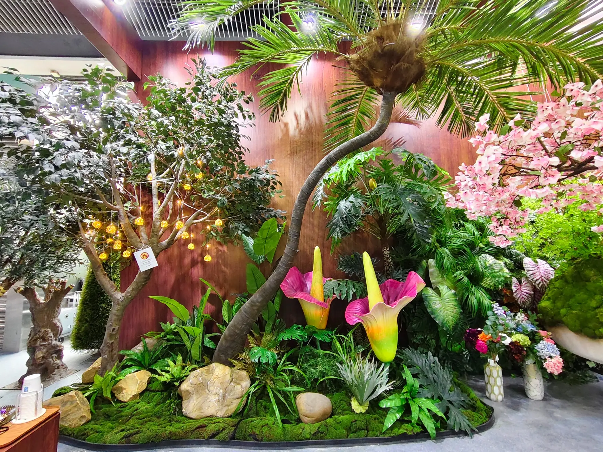 Oakco Artificial Landscape Insights Oakco artificial trees and layered greenery displayed in a commercial landscape setting