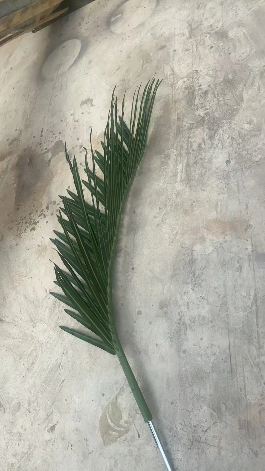 Reinforced Artificial Palm Frond Stem Reinforced steel stem inside an artificial palm frond