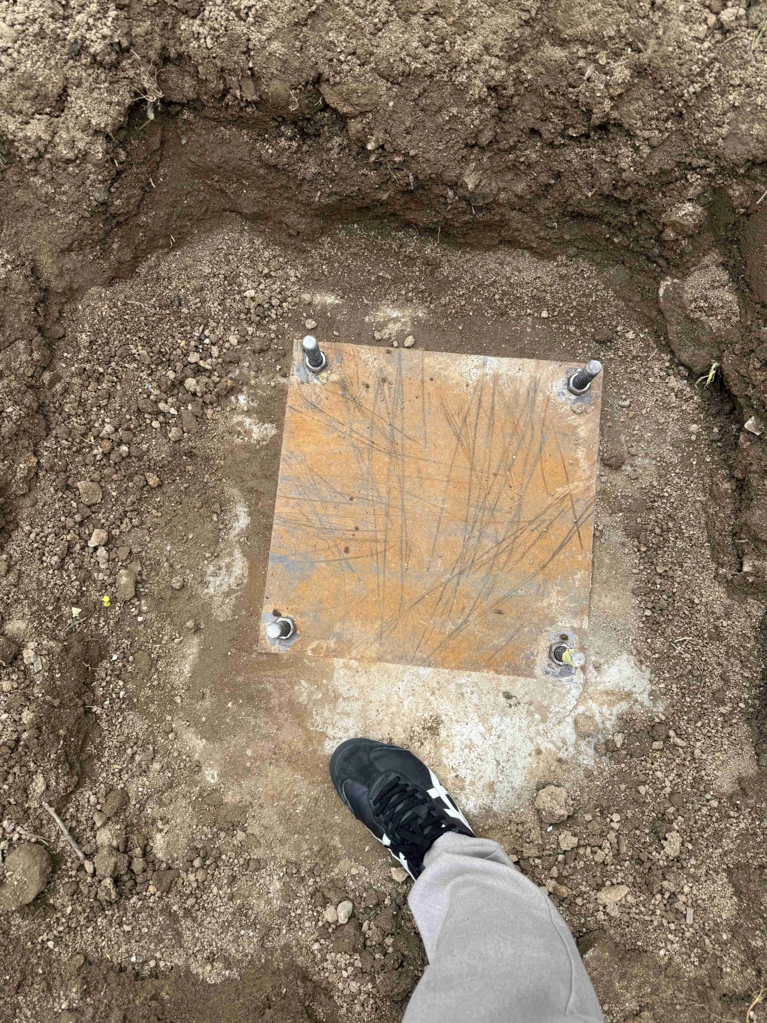 Artificial palm tree reinforced foundation and base plate preparation