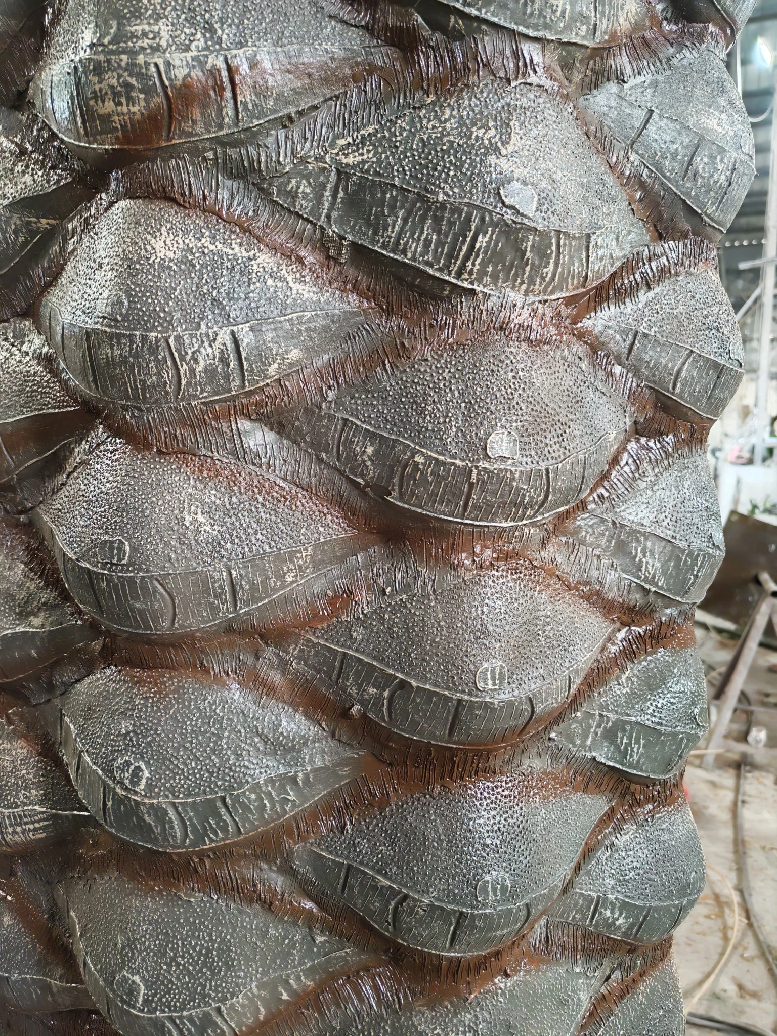 Hand-Finished Artificial Palm Trunk Close view of a hand-finished artificial palm tree trunk