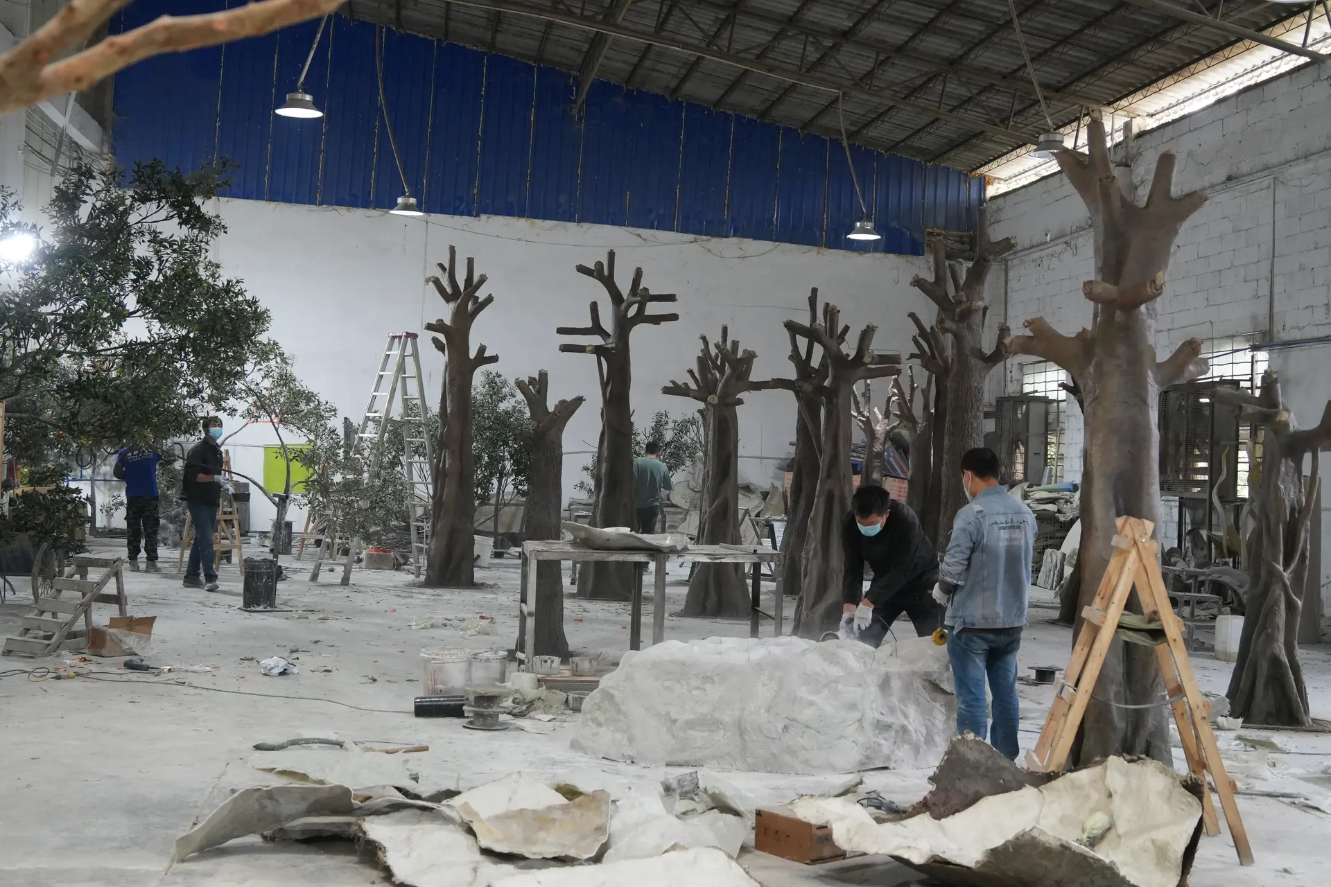 Oakco craftspeople producing custom artificial tree structures in the workshop.