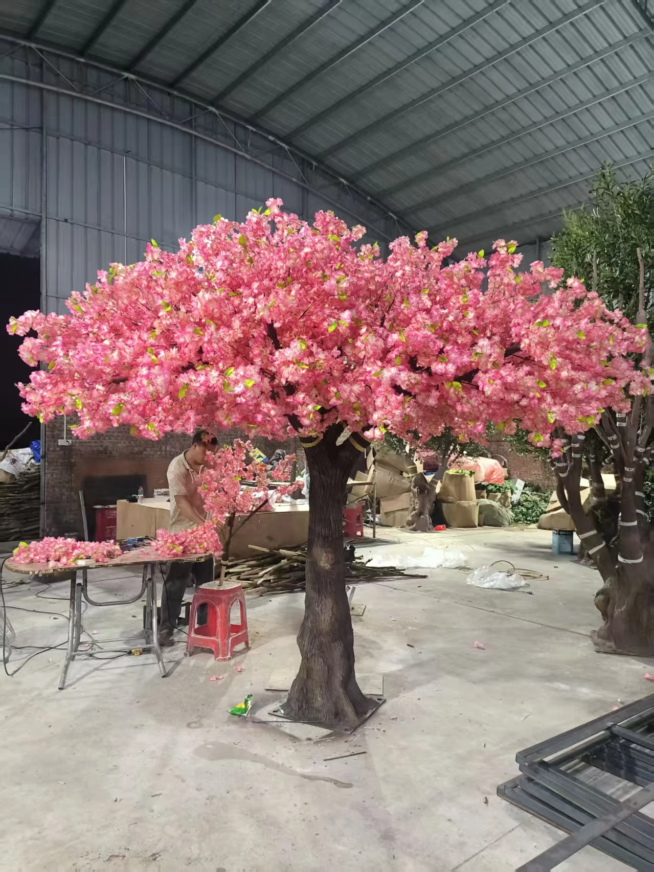 Completed pink artificial cherry blossom tree reviewed in the Oakco workshop