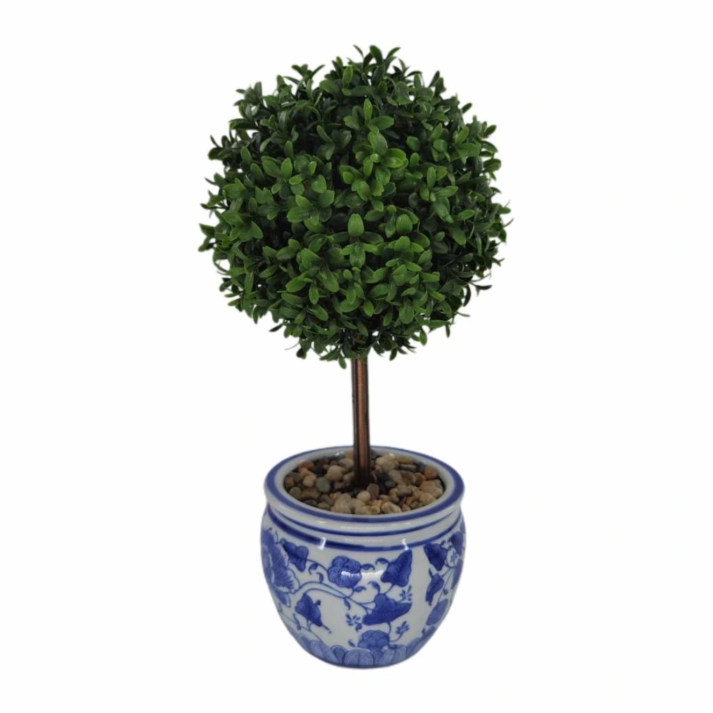 Artificial boxwood ball topiary in a blue and white ceramic planter