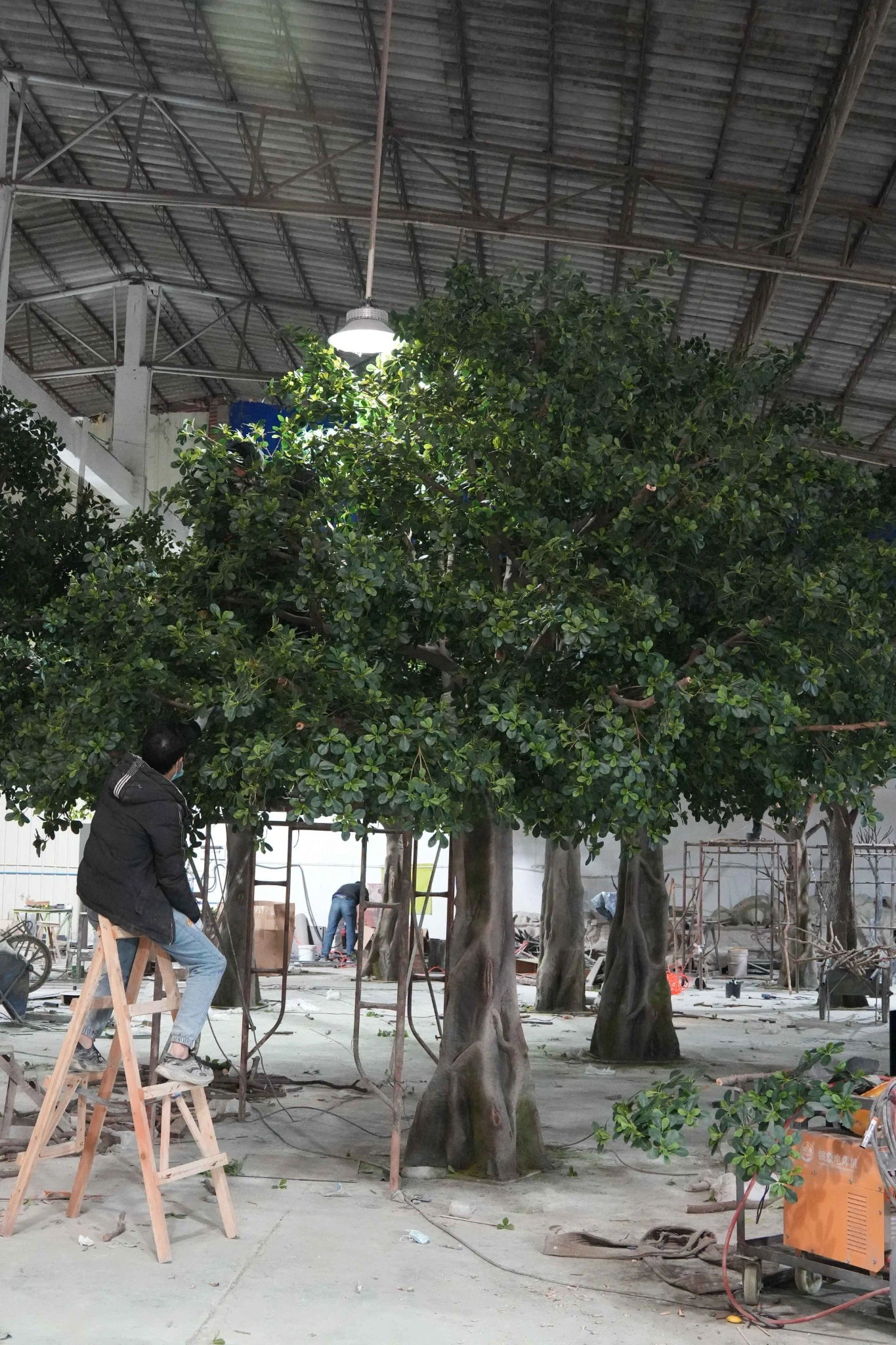 Finished artificial banyan tree reviewed in the Oakco workshop before packing and shipment