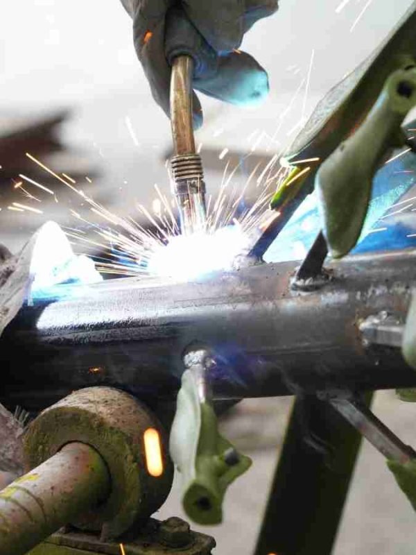 Expert welding process of the internal steel structure for an Oakco artificial fern tree.