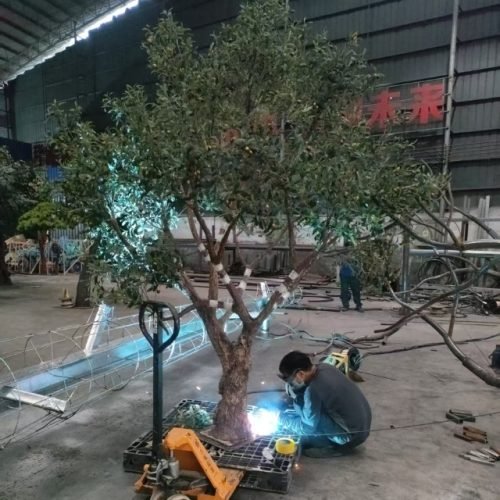 production of polished base stands for artificial large olive trees